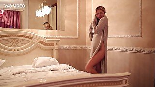 Magnificent and lean blonde model undresses and poses on the bed