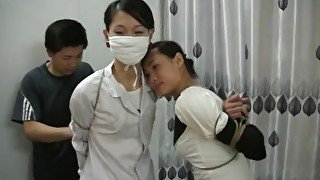 Two Chinese Girls Tied, One Wearing Cloth Mask