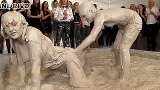 Mud wrestling between two fierce and hot bombshells