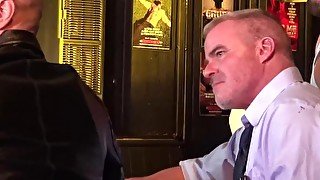 Two officers have their asses eaten and cocks sucked by multiple men at the bar