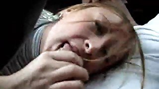 Girl sucks condom boner in the car