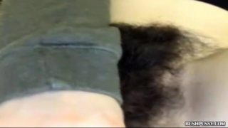 Close up of girl playing with massive hairy bush