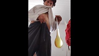 Filling a condom with piss video tape on old house