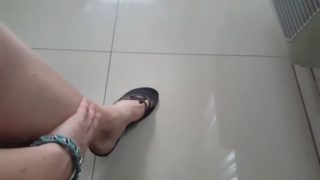 Sweet pointed feet playing with flipflops