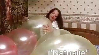 Squeeze balloons to pop