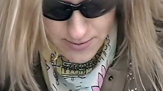 Blonde young babe in sunglasses pisses and flashes her hairy pussy