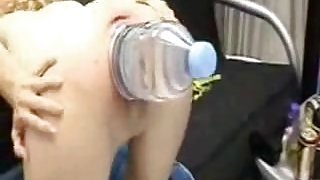 Big plastic water bottle stretches out her pussy