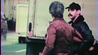 Vintage gay action as a crooked cop gives a civilian blowjob in living color