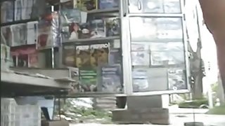 Newspaper stand upskirt video of a hot brunette