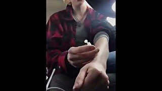 Beautiful junkie girl doing a shot in the car and singing