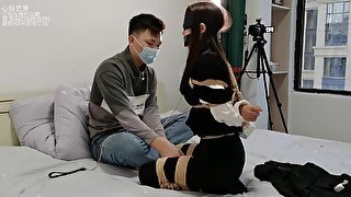 Asian Lady Blindfolded And Bound