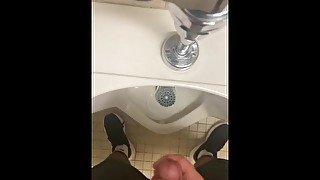 Jerking off in a public urinal