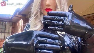 Real Rubber Doll Playing With Shiny Latex Gloves