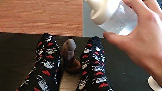 Femboy gives fantasy dildo a socked footjob