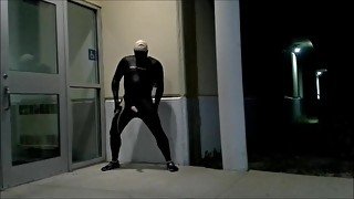 masked skinhead in orca wetsuit jerks off and pisses outside of doors