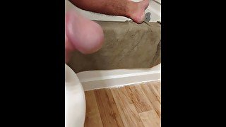 Cock blows load in bathroom