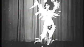 Retro whore performing strip dance on stage