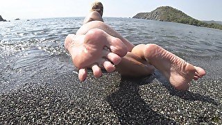 wet barefoot play on public beach 4k