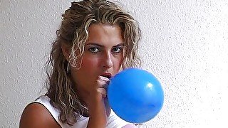 Busty blonde babe loves playing with balloons