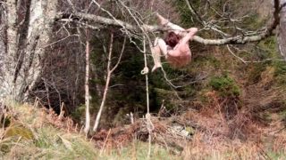 Naked self-bondage in the woods gone wrong.