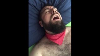 Big bearded and hairy bear wanking rubbing the bed sheet on his hard and wet cock. Beautiful Agony