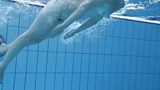 Cute Umora is swimming nude in the pool