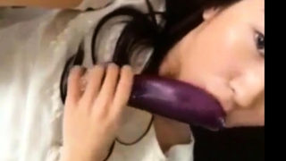 hot korean teen masturbates using eggplant