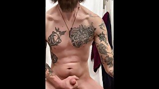 Tattooed guy jerking with dirty talk and cums early in the morning