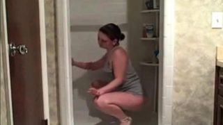 Hot milf cleaning the shower showing her ass