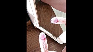 Cumming on a mirror on a sunny day POV