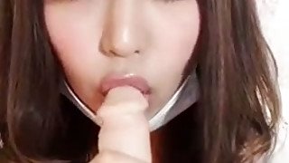 Sweet Japanese doll is sucking sex toy imitating deepthroat blowjob