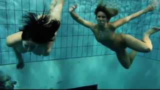 Two sexy amateurs showing their bodies off under water