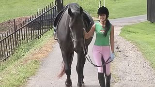 In the barn this cowgirl rides a cowboy in a hay filled stall