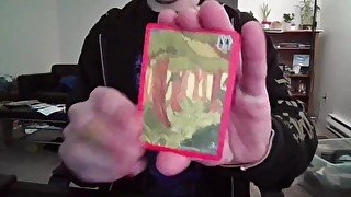 Cute Nerd Opening a Pack of Cards