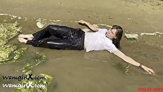 Wetlook down at the Estuary. Wearing black sports trousers and a white T-shirt