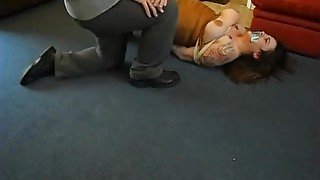 Plump girl is tied on the floor