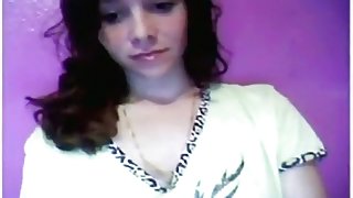 Brunette girl plays with her tits and shaved pussy on her bed