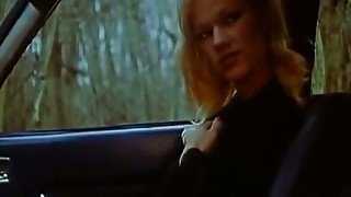 Luscious Brigitte Lahaie rubs her pussy while taking a ride on her BF's car