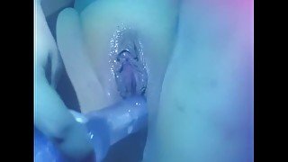 girl entertains her pussy with a rubber dick and cums from it