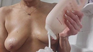 Dirty milf washes off in bubble bath