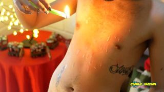 Young Uncut Latino In Colorful Christmas Wax Play With Carols In The Back