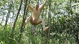 Kudoslong outside undresses and climbs the trees naked