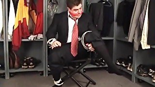 Suited coach tied to chair and cleave gagged in the locker room