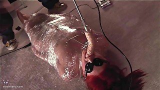 Redhead submissive MILF babe is wrapped in foil and face fucked