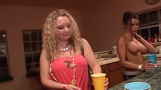 Sensual chicks showing off their amazing boobs in the kitchen