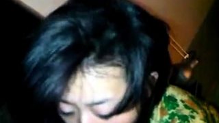 Naughty Vietnamese slut sucks a dark cock