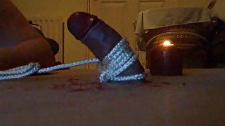 Dripping hot wax on his cock