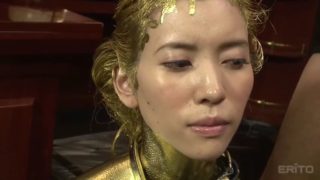 Sex slave covered in golden paint craves a stiff dong