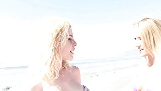 Blonde lesbians having oral sex after walking on the beach