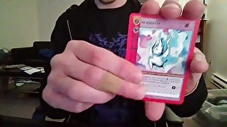 Cute Nerd Opening a Pack of Cards